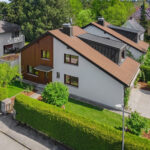 Freistehendes Einfamilienhaus mit Garten und Garage in familienfreundlicher Wohnlage von München