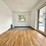 Erstbezug! Moderne Neubauwohnung auf zwei Etagen, mit Tiefgaragenstellplatz und eigenem Garten